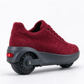 Burgundy suede electric sneaker in profile with the heel wheel and tail light