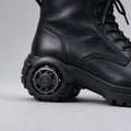 Side view of the black leather combat boot with lug sole and heel wheel