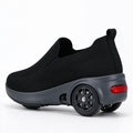 Pair of black knit slip-on electric shoes with a red heel light in profile